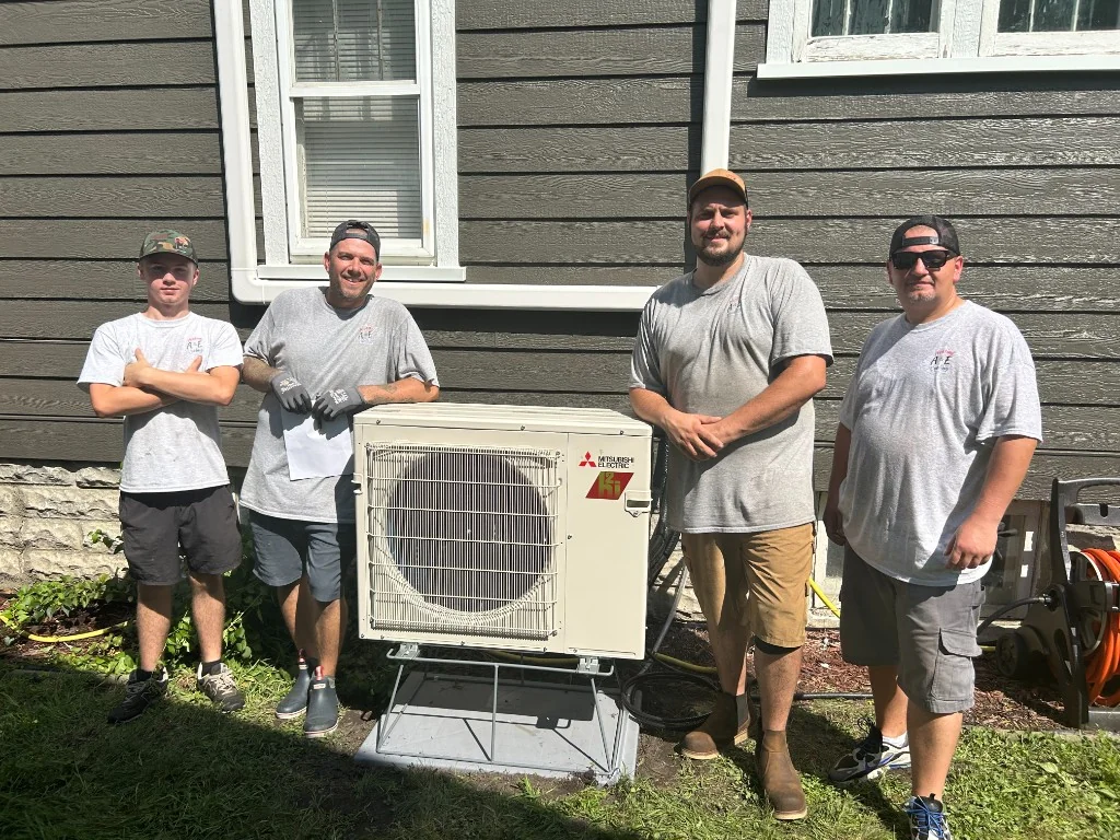The A&E Heating & Cooling crew with a Mitsubishi mini-split installation