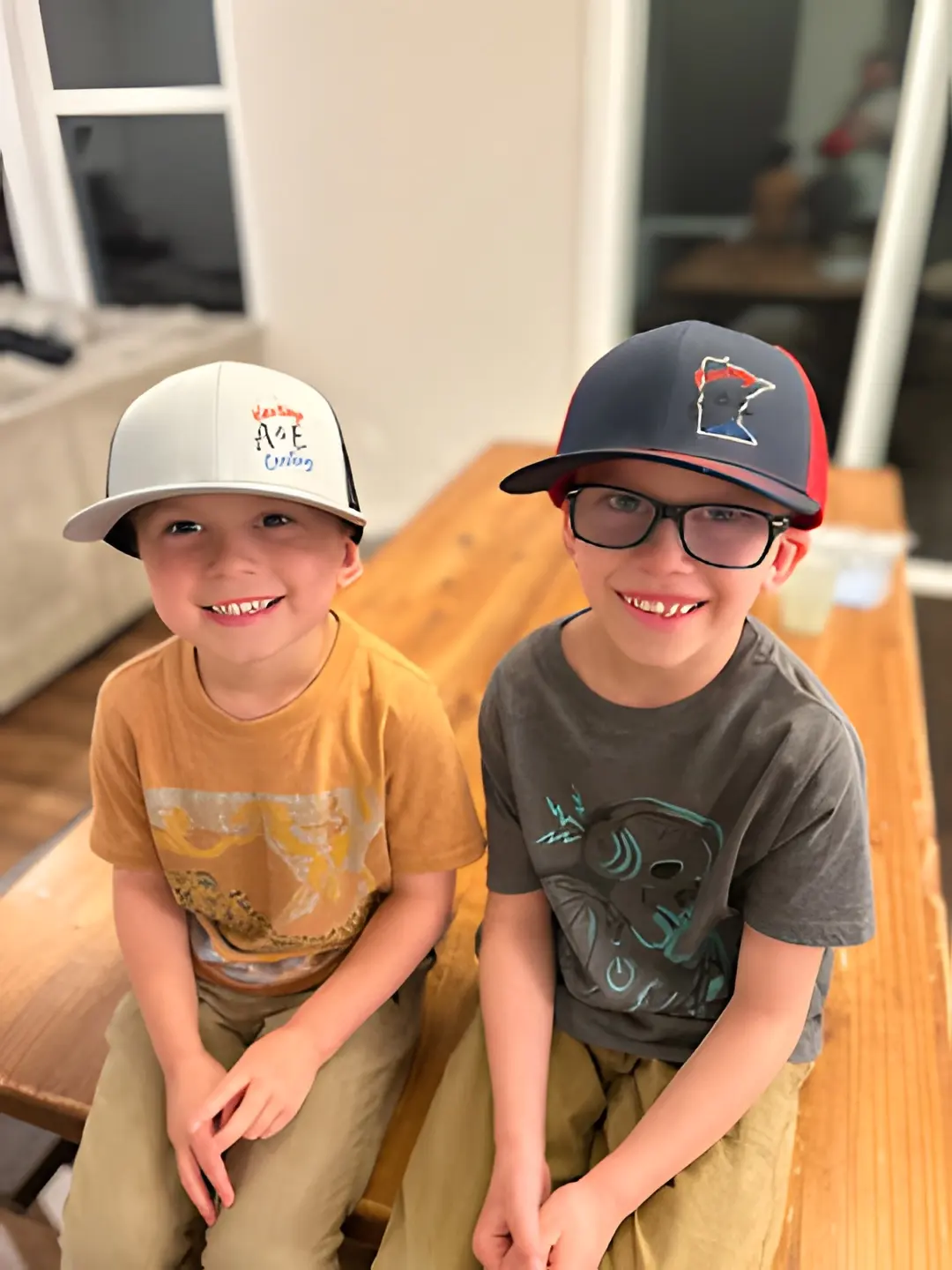 A&E kids wearing A&E Heating & Cooling hats